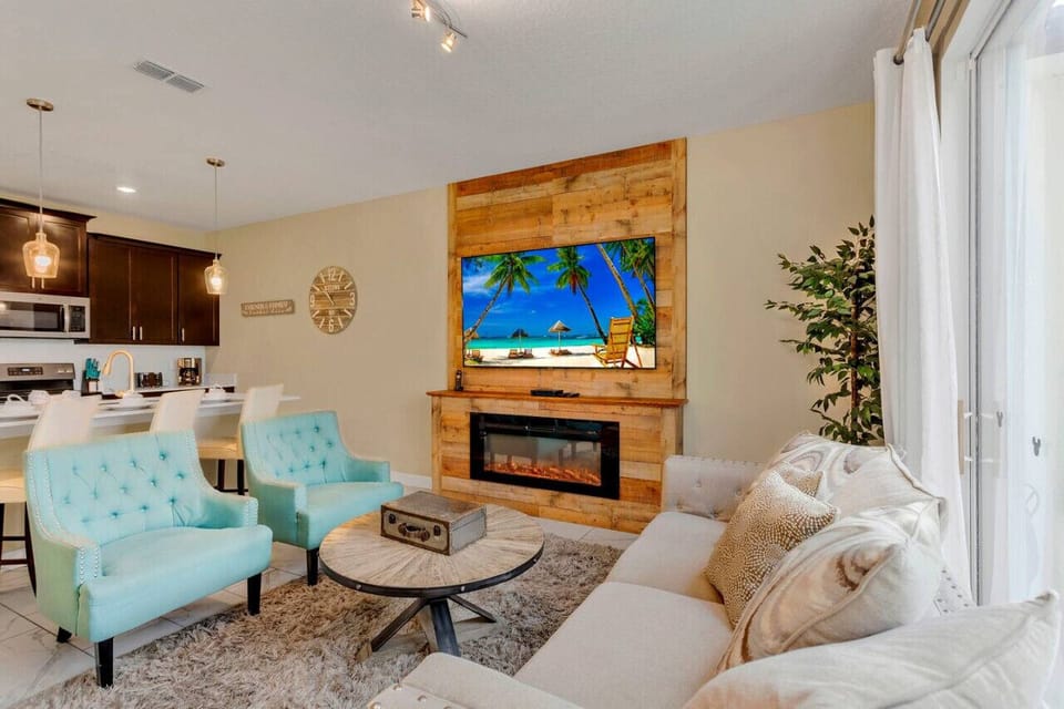 Living Room with 70` Smart TV & Fire Place!#Disney #Parks #kingdom #springs #StoreyLake #Apartment #Vacation #Rental #waterpark #Kissimmee #Orlando #universal #citywalk