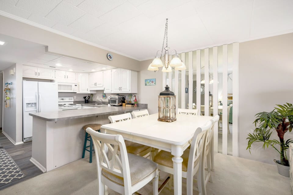 Enjoy a home cooked meal at the Dining Table, seating a family of 6.