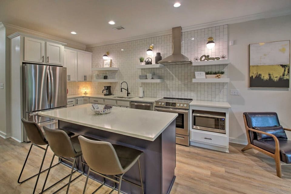 A chef’s dream kitchen – stainless steel appliances, spacious island, and everything you need to cook at home