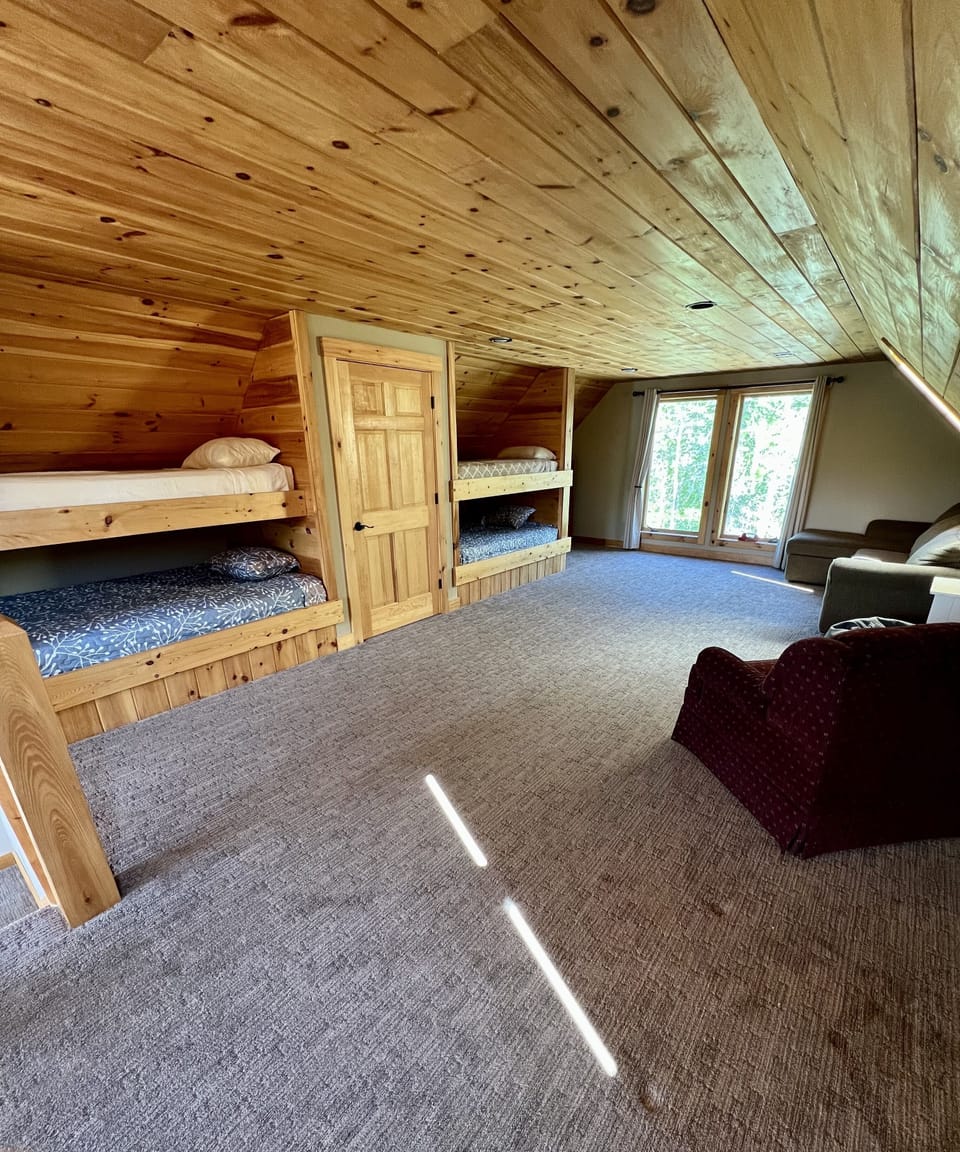 3rd floor bunk room includes two twin beds, two full beds, and pull-out couch