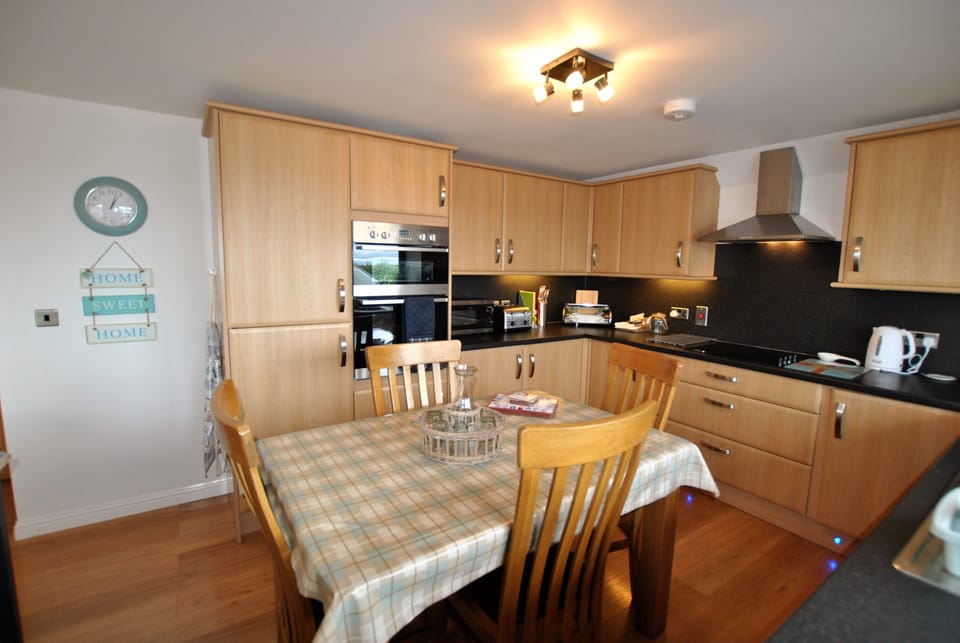 The kitchen is modern and well equipped