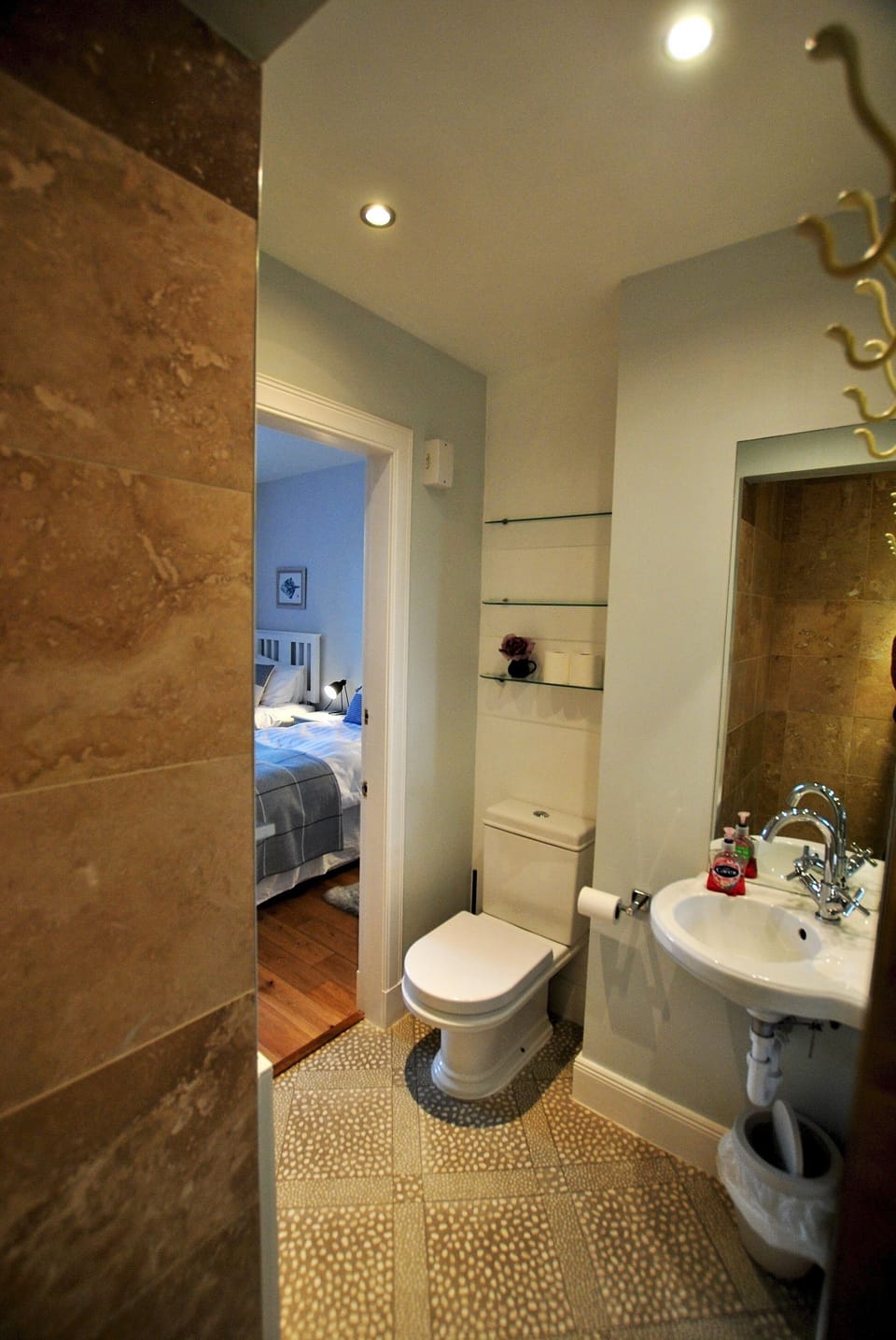 The en-suite shower room is modern and fresh
