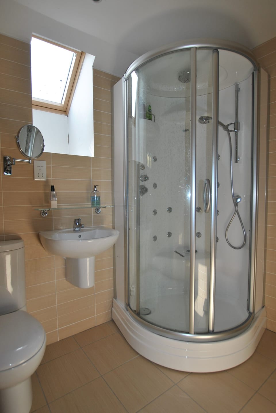 The master bedroom has an en-suite shower room