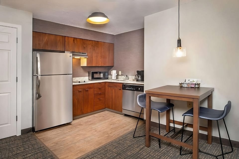 Cook easy meals in the sleek kitchenette with full-size fridge