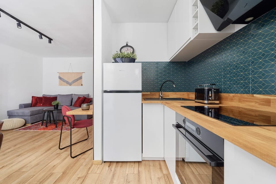Another angle of the kitchen and dining area, showcasing a blend of modern and classic elements.
