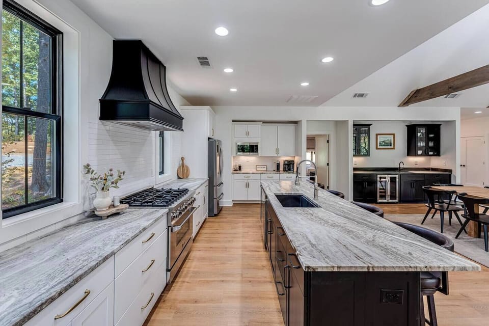 Chef's kitchen with a professional gas range, built for cooking for the group.