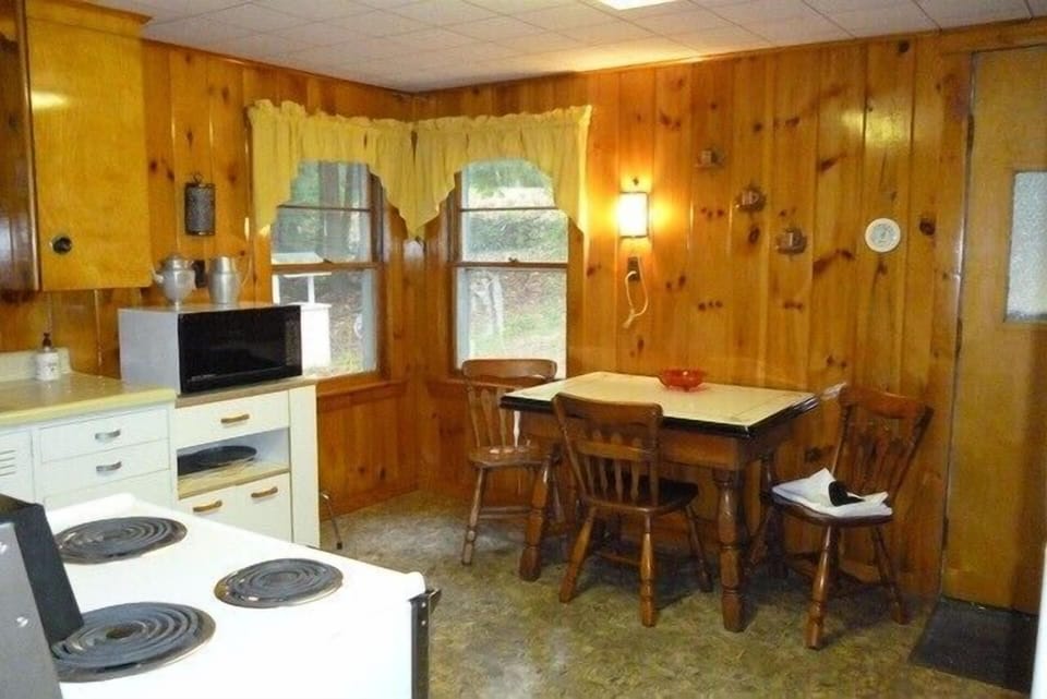 kitchen area with a dining table