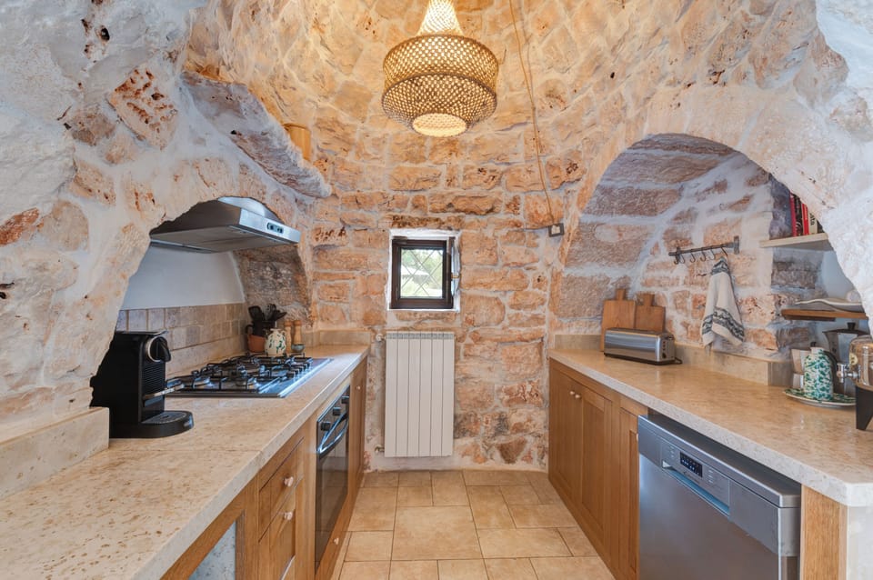 Full size dishwasher and Nespresso capsule coffee machine.