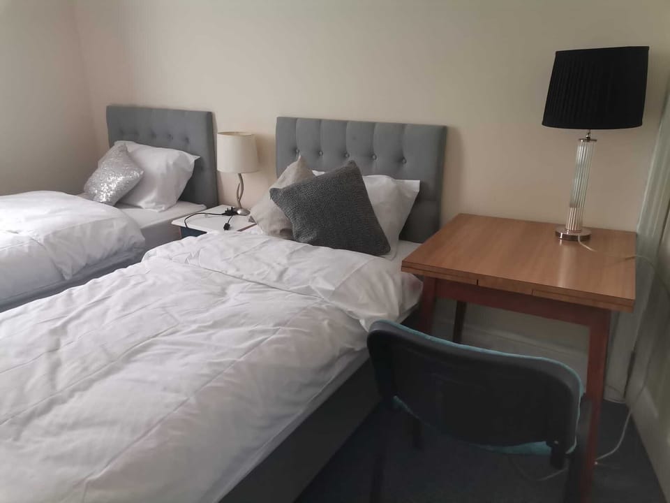 large bedroom with 2 single bed