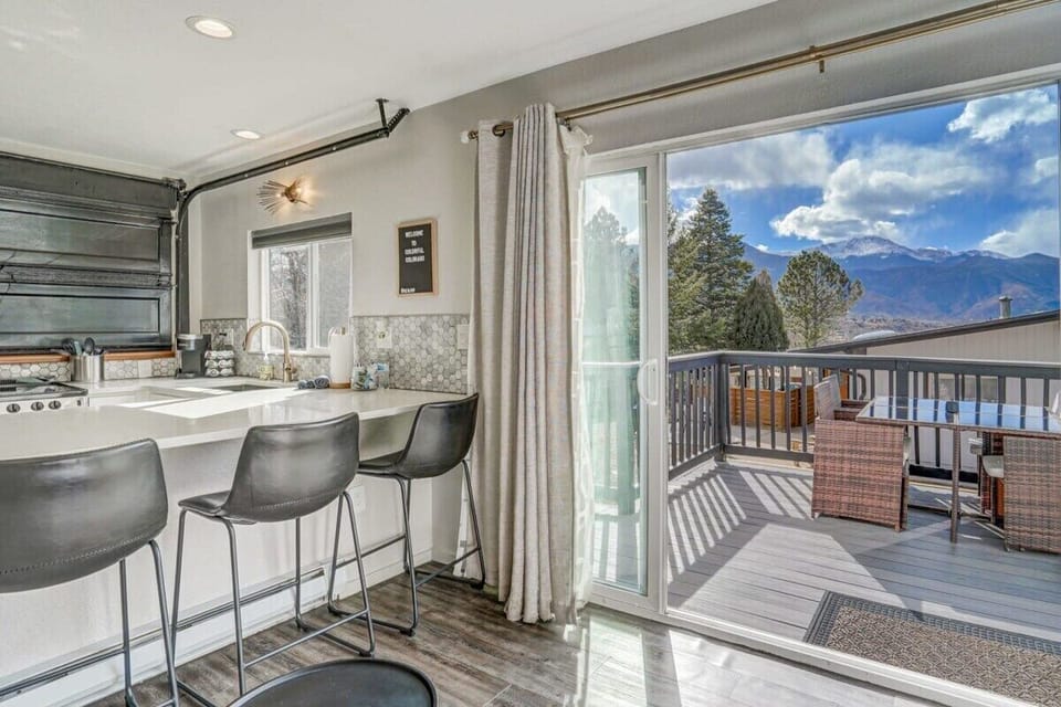 Breathtaking beauty of Pikes Peak! Slide open the glass doors for an awe-inspiring view. Whether indoors or on the deck, find your perfect spot to relax in total comfort.