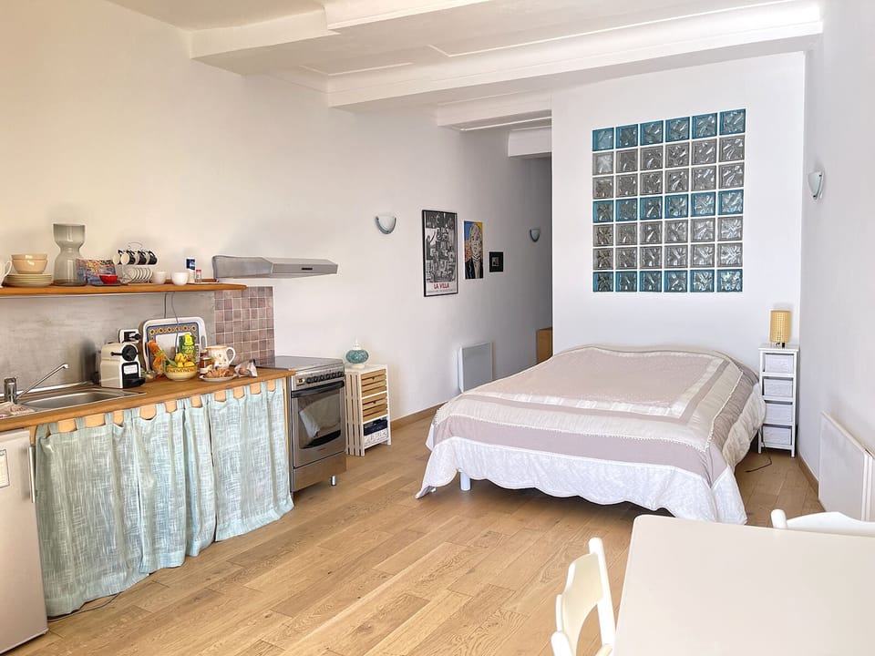 The room with the double bed and the kitchenette