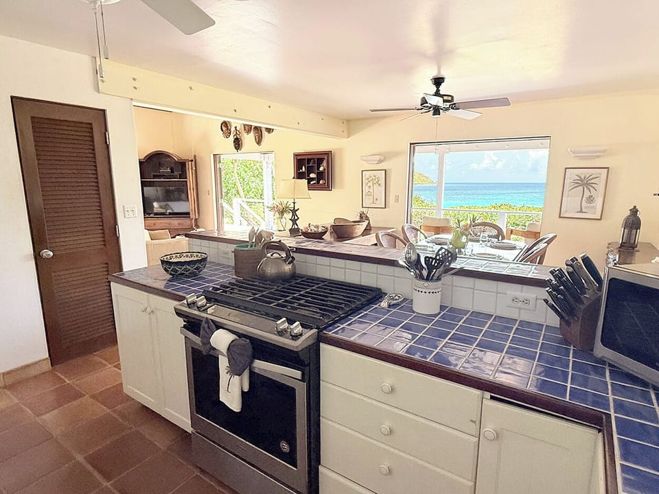 The kitchen looks out to the ocean views