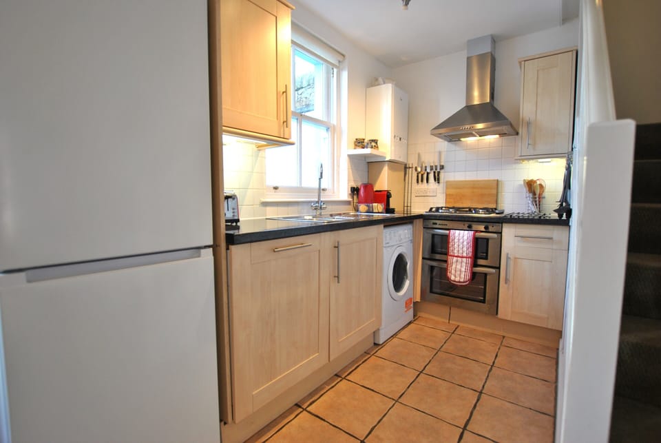 The kitchen is compact but fully equipped including dishwasher