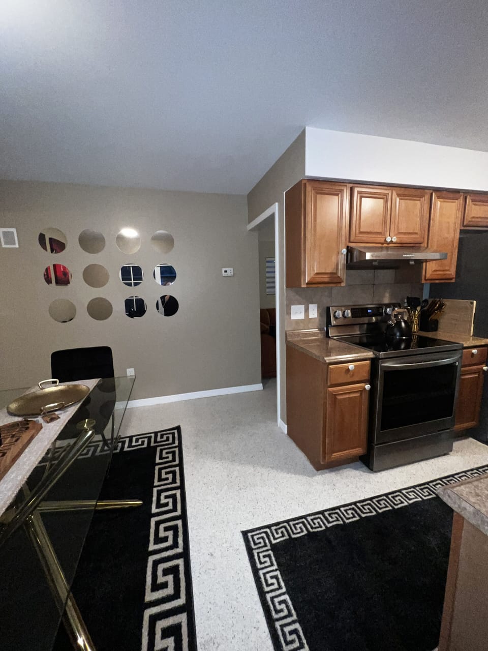 Kitchen has new appliances, porcelain dishes serving plates chrystal glasses.  