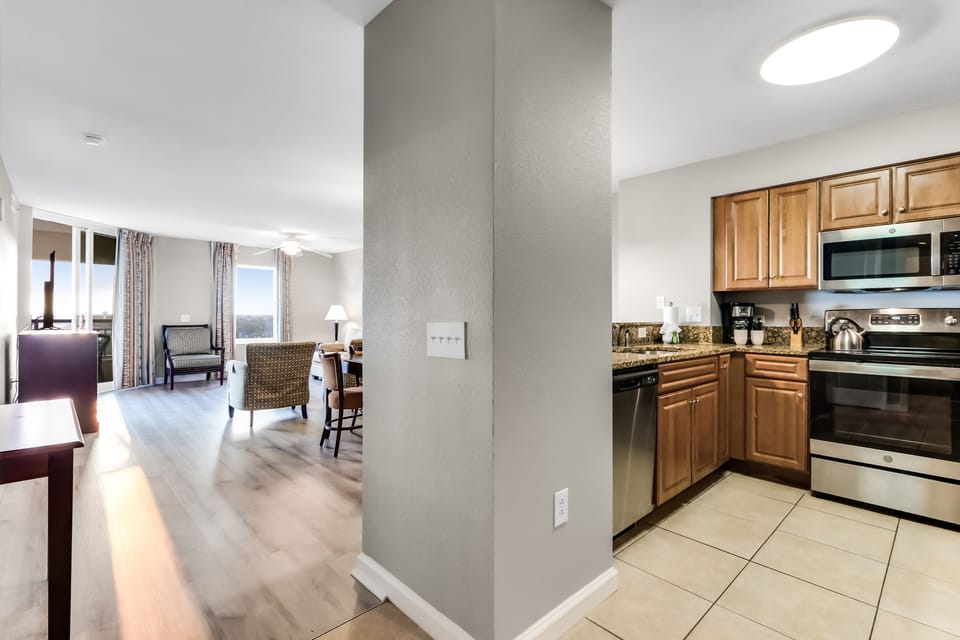 Your spacious suite features a fully equipped kitchen with modern appliances and an open layout connecting to comfortable living areas.
