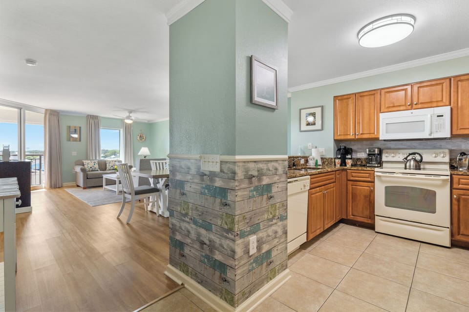 Your spacious open-plan retreat blends coastal charm with modern convenience, featuring a fully-equipped kitchen and bright living spaces.