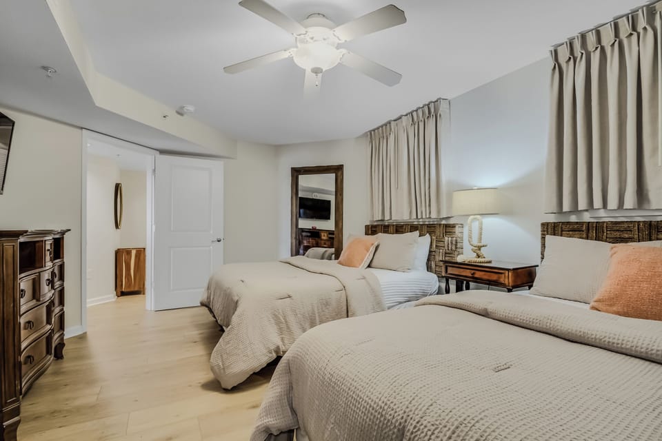 Unwind in your spacious retreat with two plush beds, crisp linens, and warm touches that create the perfect sanctuary for restful nights.