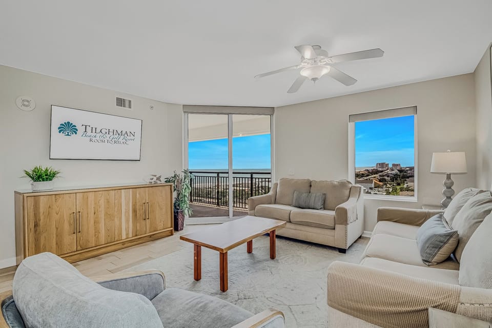 Relax in your bright living space with plush seating and stunning city views from your private balcony.