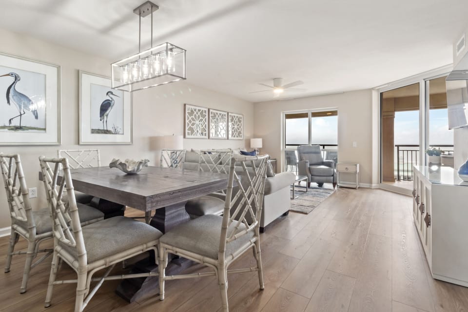 Relax in your stylish open-plan space featuring elegant dining and living areas with stunning balcony views.