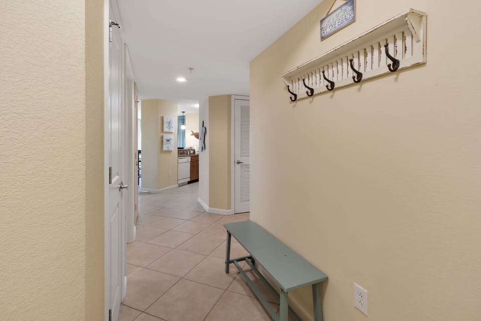 Drop your beach gear on the convenient bench and hang your belongings on the charming hooks in this welcoming entryway.