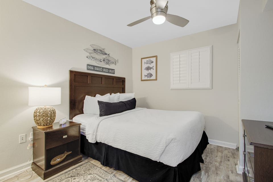 Your coastal-themed bedroom features crisp white linens and nautical décor for peaceful nights by the sea.