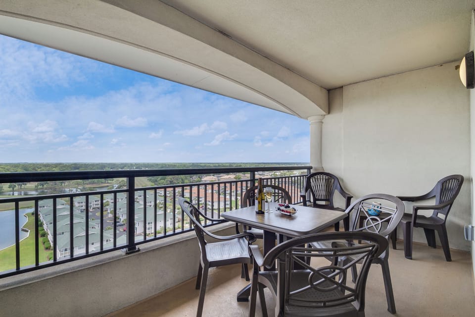 Step onto your private balcony and soak in the expansive view while enjoying morning coffee at your outdoor dining table.