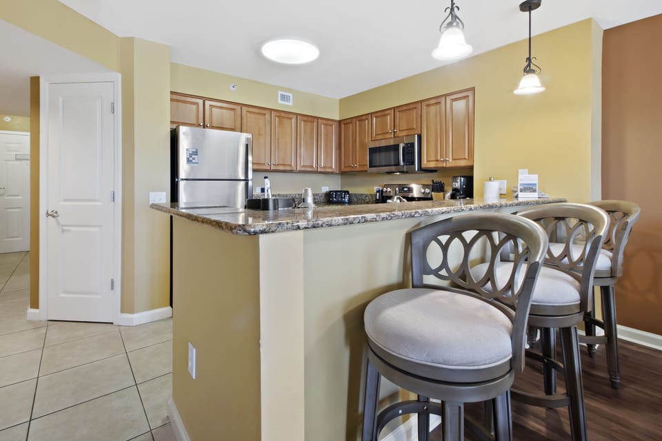Your fully equipped kitchen features granite counters and bar seating where you can enjoy morning coffee or casual meals together.
