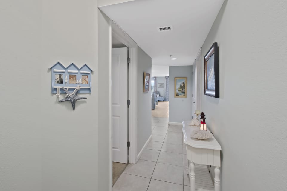 Your private hallway welcomes you with coastal charm and thoughtful touches throughout your stay.