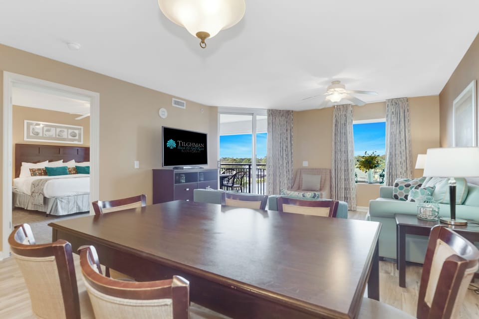 Gather around the spacious dining table while ocean views fill your windows, creating perfect moments for meals and memories together.