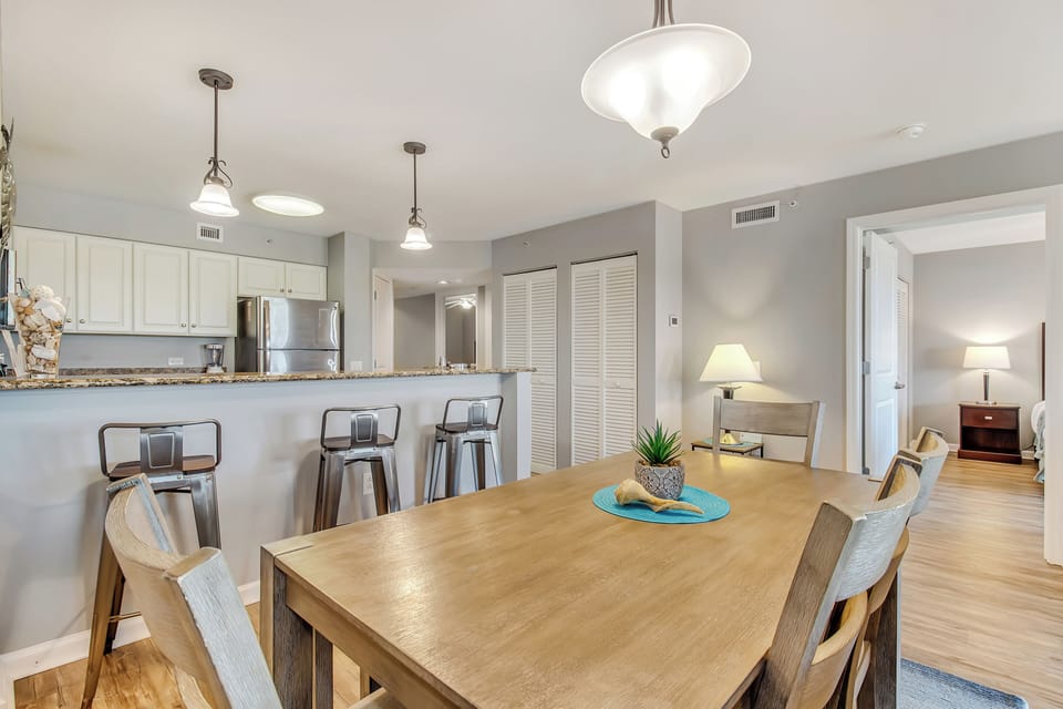 Gather around your spacious dining table for memorable meals together in this open-concept space that flows seamlessly into the modern kitchen.