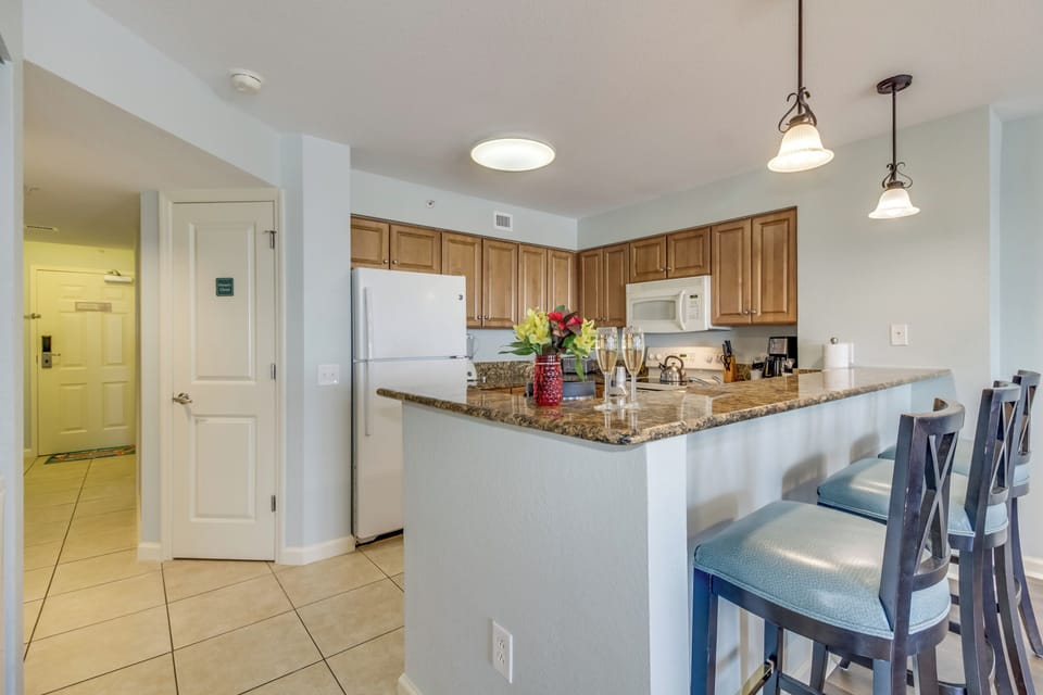 Your fully-equipped kitchen awaits with granite counters, modern appliances, and breakfast bar seating for easy meal prep.