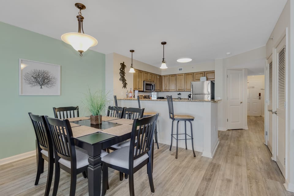 Gather around your spacious dining table for memorable meals, with a fully equipped kitchen ready for cooking adventures.