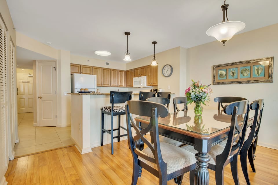 Your open-concept kitchen and dining space features warm wood floors, granite counters, and elegant seating for memorable meals together.