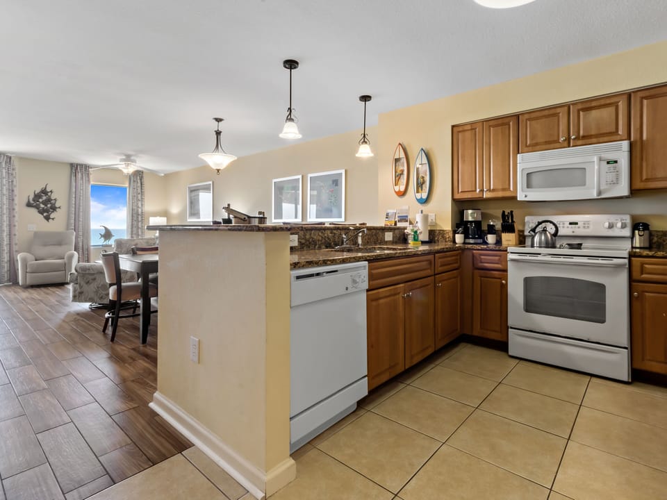 Your spacious kitchen flows seamlessly into the dining area, perfect for preparing meals and gathering with loved ones during your stay.