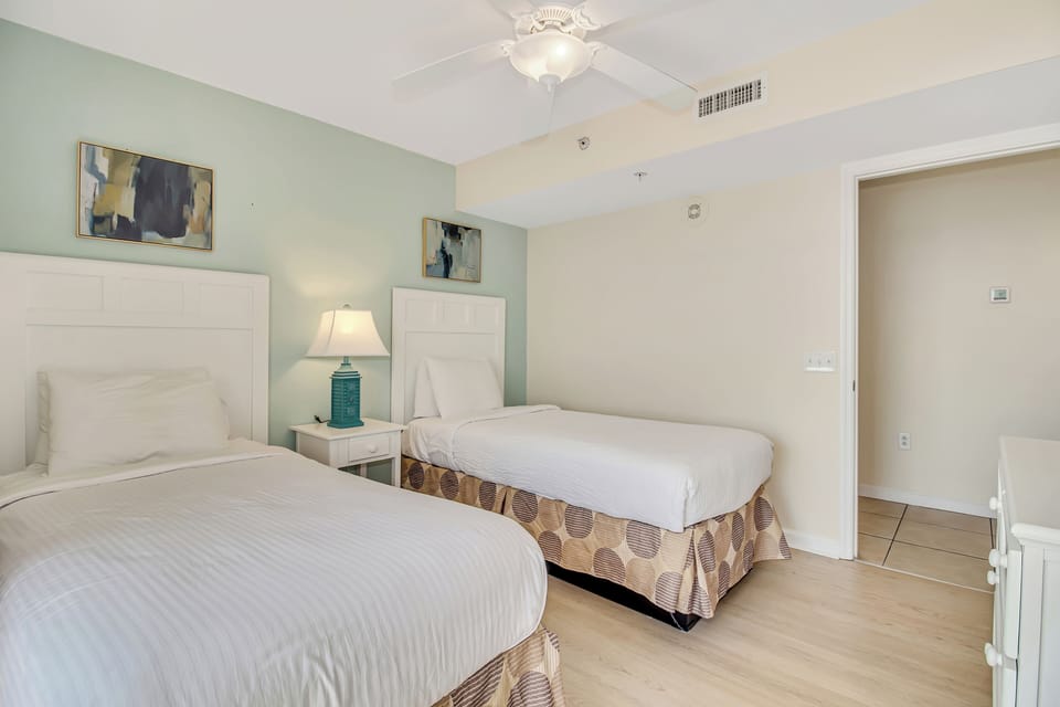 Drift into peaceful sleep in your twin bedroom with crisp linens and calming coastal colors.