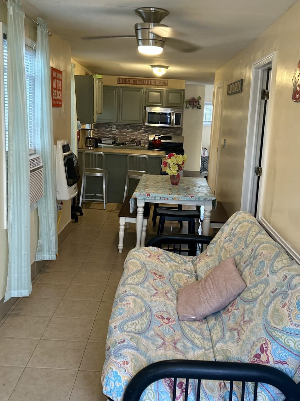 Table seats 6-8 futon opens to full bed. Full kitchen