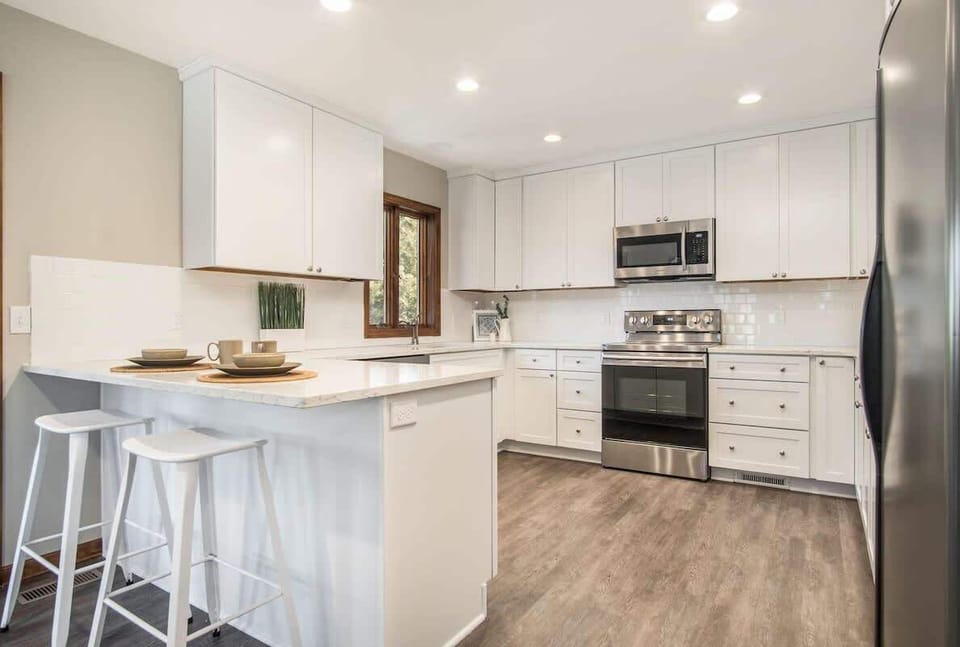 Kitchen with island seating and appliances