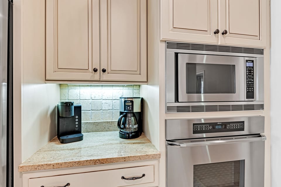 Dacor Wall ovens and a coffee station with both a drip coffee maker and a Keurig