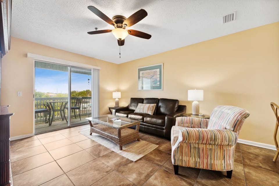 Spacious living room with a sofa and accent chair.