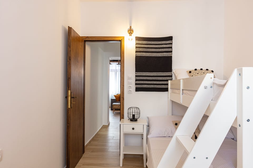 The bedroom with the large bunk bed for 3 people
