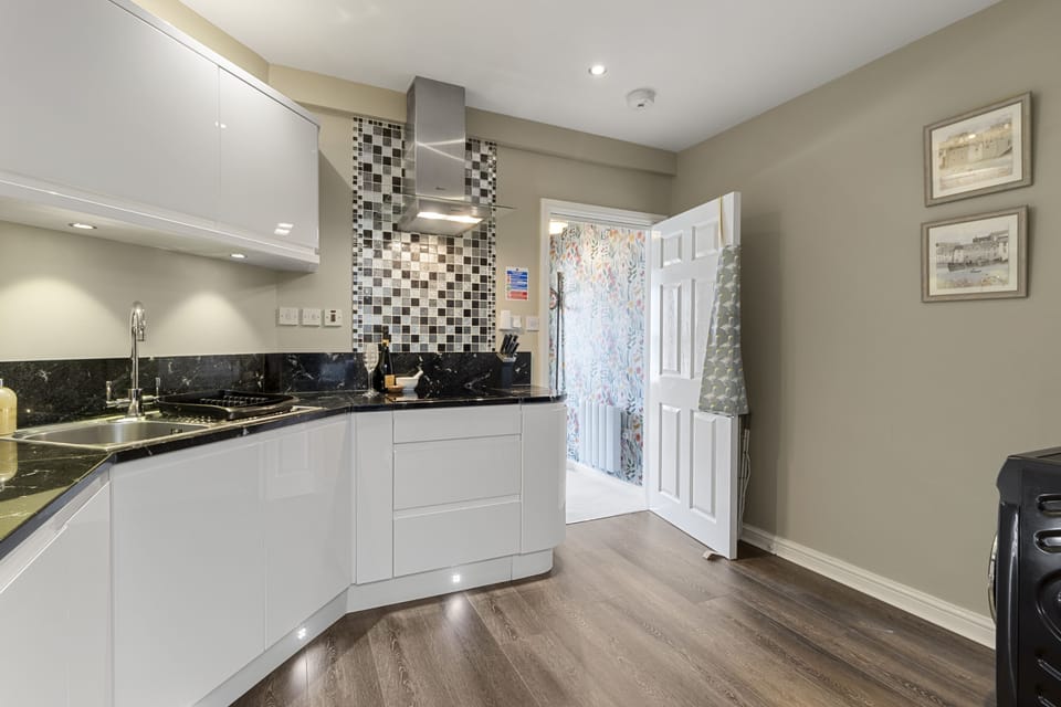 Enjoy preparing meals in the fully equipped kitchen, complete with integrated appliances and a large selection of crockery and glassware.