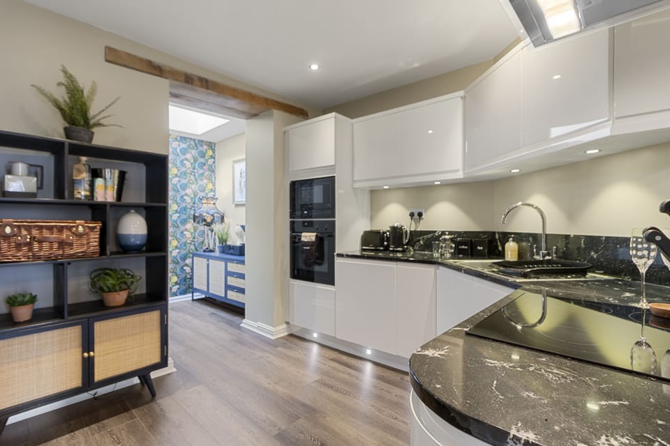Enjoy preparing meals in the fully equipped kitchen, complete with integrated appliances and a large selection of crockery and glassware.