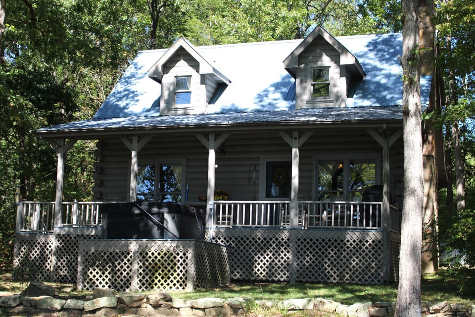 Back of cabin with hot tub