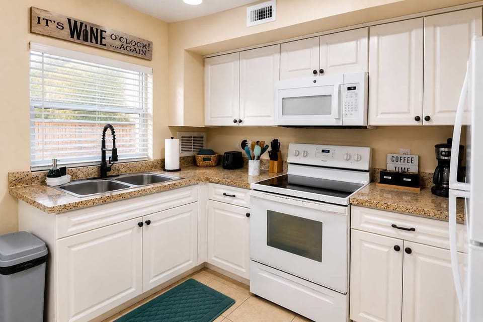 Bright and functional kitchen with practical counter space and everything needed for comfortable cooking and dining.