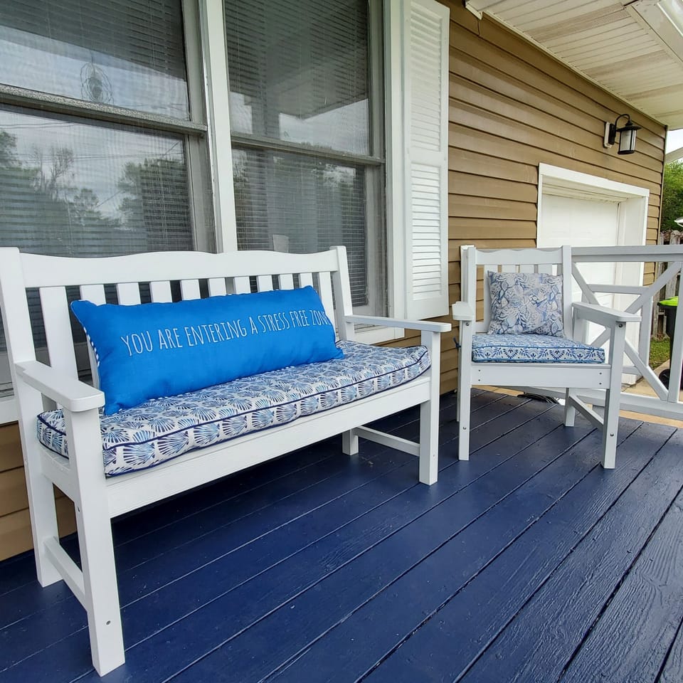 The pillow says it all!  You are ENTERING A STRESS FREE ZONE. Great front porch!