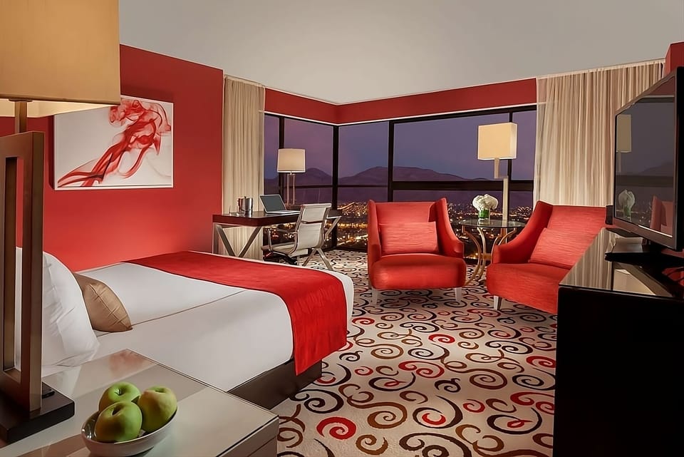 Soak in dazzling city views from this bold, luxe suite.