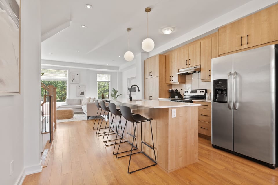 Open kitchen on main level divides the living room and dining room. 
