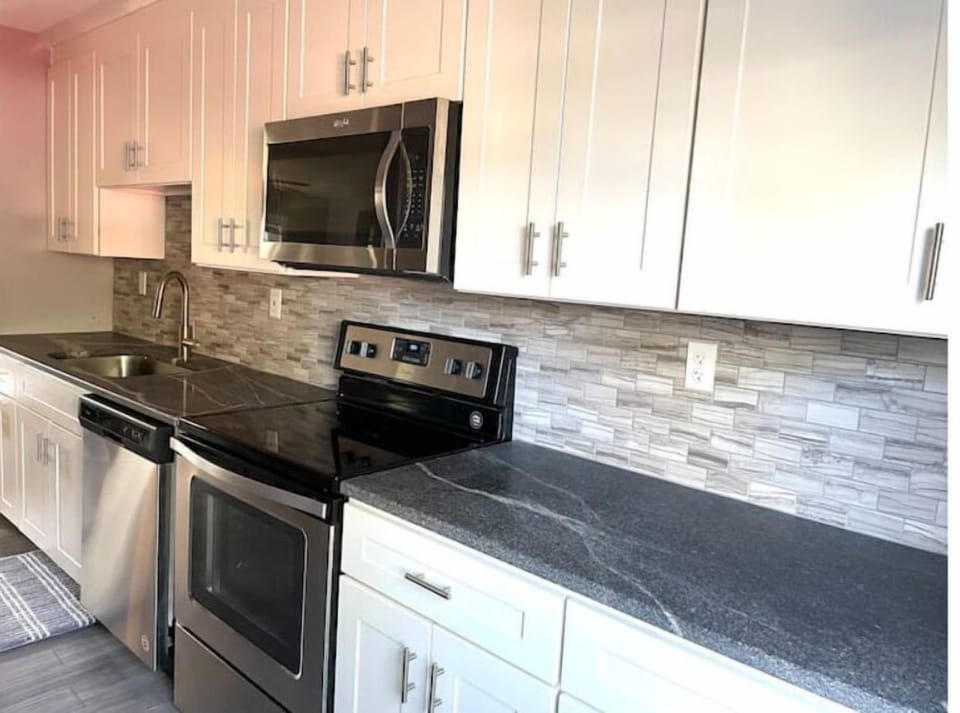 Updated kitchen with soft-close cabinets, granite and stainless steel appliances