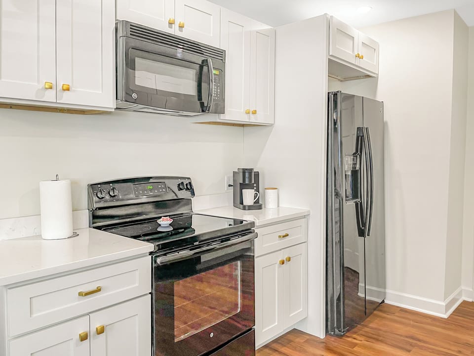 Fully equipped kitchen with full-sized appliances. Drip coffee maker and coffee 