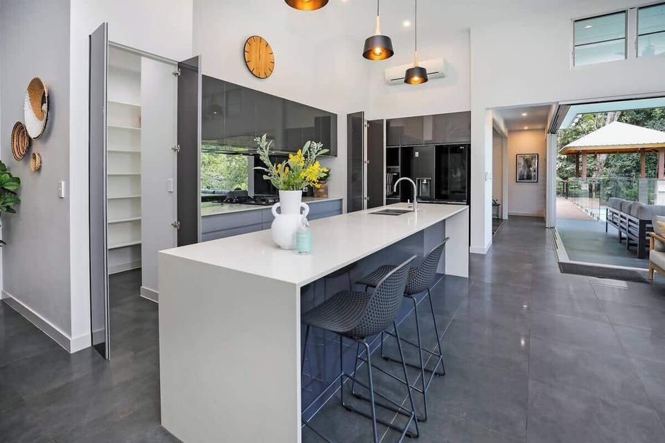 Kitchen | Pindari Retreat | Open plan layout connecting the kitchen, lounge, dining and alfresco lounge.